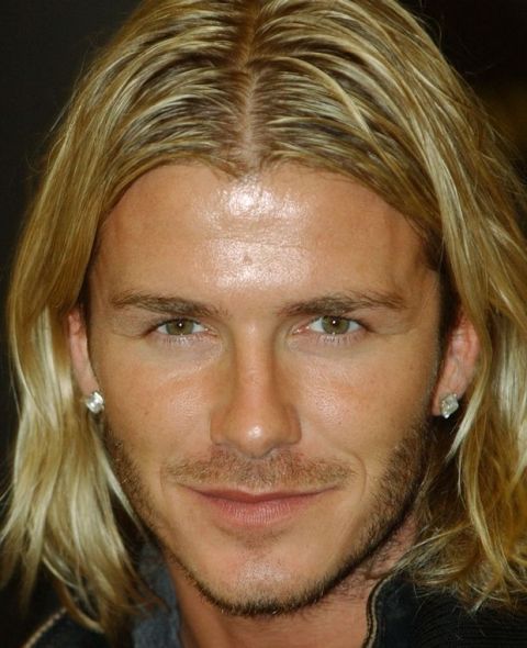 England and Real Madrid soccer player David Beckham pauses during a signing session for his autobiography "My Side" held at a London bookstore, Monday Nov. 17, 2003. (AP Photo/Richard Lewis)