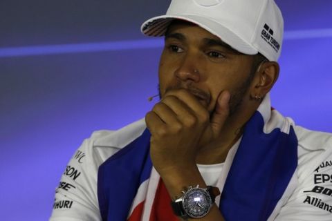 Mercedes driver Lewis Hamilton, of Britain, listens a question during a press conference after the Formula One Mexico Grand Prix auto race at the Hermanos Rodriguez racetrack in Mexico City, Sunday, Oct. 29, 2017. Hamilton won his fourth career Formula One season championship on Sunday with a ninth-place finish at the Mexican Grand Prix in a race won by Red Bull's Max Verstappen. (AP Photo/Marco Ugarte)