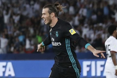 Real Madrid's Gareth Bale celebrates after scoring his side second goal during the Club World Cup semifinal soccer match between Real Madrid and Al Jazira Club at Zayed sport city in Abu Dhabi, United Arab Emirates, Wednesday, Dec. 13, 2017. (AP Photo/Hassan Ammar)
