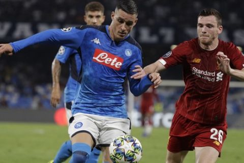 Napoli's Jose Callejon, left, and Liverpool's Andrew Robertson fight for the ball during the Champions League Group E soccer match between Napoli and Liverpool, at the San Paolo stadium in Naples, Italy, Tuesday, Sept. 17, 2019. (AP Photo/Gregorio Borgia)