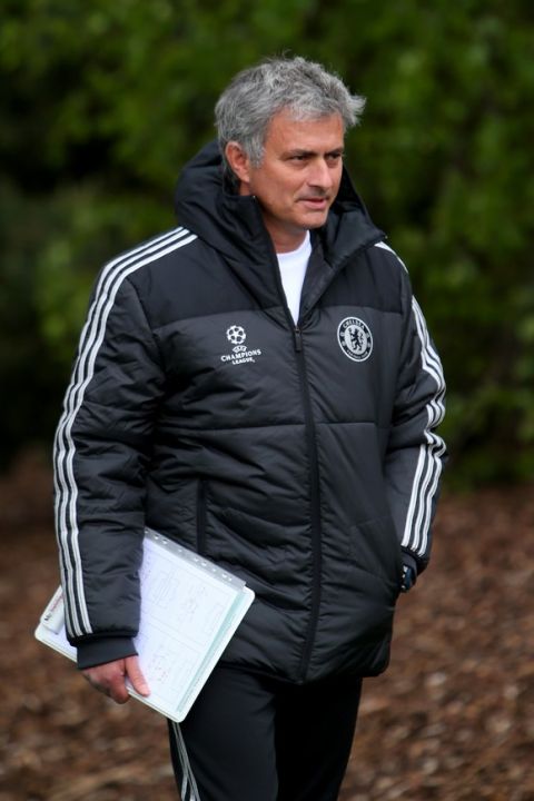 COBHAM, ENGLAND - APRIL 29:  Jose Mourinho of Chelsea walks out to the pitch prior to a training session at Chelsea Training Ground on April 29, 2014 in Cobham, England.  (Photo by Clive Rose/Getty Images)