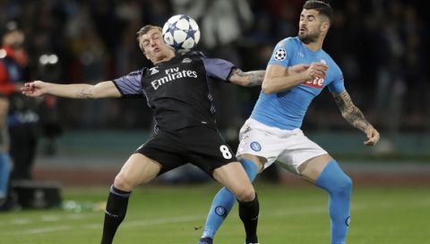 Real Madrid's Toni Kroos, left, fights for the ball with Napoli's Elseid Hysaj during the Champions League round of 16, second leg, soccer match between Napoli and Real Madrid at the San Paolo stadium in Naples, Italy, Tuesday March 7, 2017. (AP Photo/Andrew Medichini)
