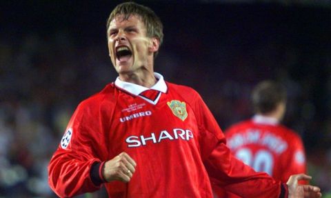 ** FILE ** Manchester United's Teddy Sheringham celebrates after scoring the equaliser during the UEFA Champions Cup final soccer match at the Nou Camp Stadium in Barcelona in this Wednesday May 26, 1999 file photo. Former England striker Sheringham will retire from soccer at the end of the season and end a 24-year playing career remarkable for its longevity and late blossoming. Even though Sheringham, who is midway through a season with Colchester in the second-tier League Championship, was 33 before he won a major title, he will leave with three Premier League medals and one each from the FA Cup and the Intercontinental Cup.  The 41-year-old forward played 51 times for England and had two stints with Tottenham, but was most famous for scoring a late equalizer and then setting up the winner in Manchester United's 2-1 win over Bayern Munich in the 1999 Champions League final.  (AP Photo/Camay Sungu, File)