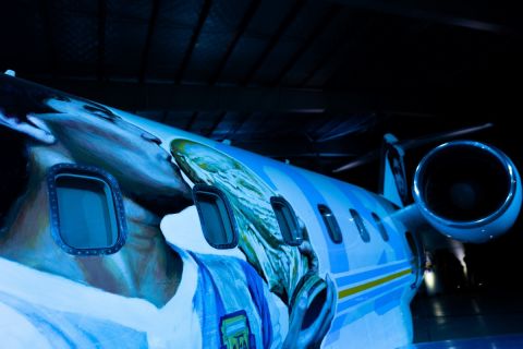 View of an aircraft called Tango D10S painted with images depicting Argentine late football star Diego Armando Maradona holding the World Cup, during its presentation in Moron, Buenos Aires province, Argentina, on May 25, 2022. - Some of the 1986 FIFA World Cup champions will travel to the Qatar FIFA World Cup on November, 2022 in the Tango D10S to pay homage to Maradona. (Photo by Tomas CUESTA / AFP)