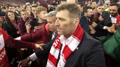 Spartak's head coach Massimo Carrera, foreground and his players celebrate, in Moscow, Russia, Wednesday, May 17, 2017. Spartak won their match against Terek Grozny to win the Russian premier league soccer title.  (AP Photo/Ivan Sekretarev)