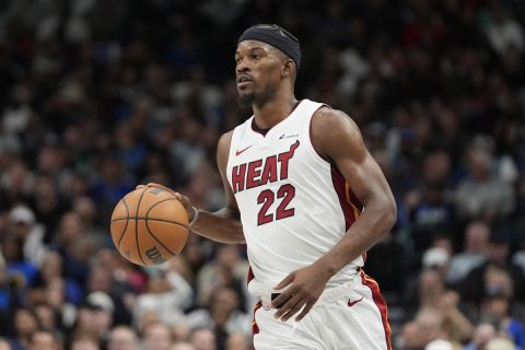 Miami Heat forward Jimmy Butler dribbles during the second half of an NBA basketball game against the Dallas Mavericks in Dallas, Thursday, March 7, 2024. (AP Photo/LM Otero)