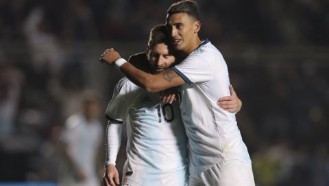 Argentina's Lionel Messi, left, celebrates after scoring the team's first goal with teammate Matías Suarez during a friendly soccer match against Nicaragua in San Juan, Argentina, Friday, June 7, 2019. (AP Photo/Nicolás Aguilera)