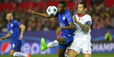Leicester City's Nigerian midfielder Ahmed Musa (L) vies with Sevilla's midfielder Vitolo (R)  during the UEFA Champions League round of 16 second leg football match Sevilla FC vs Leicester City at the Ramon Sanchez Pizjuan stadium in Sevilla on February 22, 2017. / AFP / CRISTINA QUICLER        (Photo credit should read CRISTINA QUICLER/AFP/Getty Images)