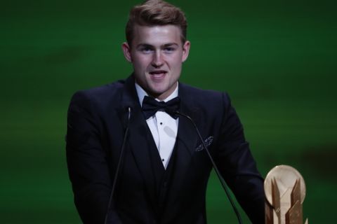 Juventus' Matthijs de Ligt with Kopa trophy speaks during the Golden Ball award ceremony at the Grand Palais in Paris, Monday, Dec. 2, 2019. Awarded every year by France Football magazine since Stanley Matthews won it in 1956, the Ballon d'Or, Golden Ball for the best player of the year will be given to both a woman and a man. (AP Photo/Francois Mori)