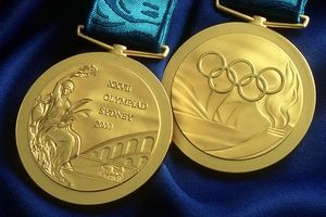The official gold medal of the Sydney 2000 Olympic Games features Nike (L), the Greek goddess of victory, on the "traditional" side, and the Olympic rings (R) above the sails of the Opera House, with the Olympic torch and waves, on the other side, 14 August 2000.  The gold medals contain 204g of silver coated with 6g of gold, the silver are made from 210g of pure silver, while the bronze medals are pressed from 170g of bronze made from one and two cent pieces no longer in circulation.  AFP PHOTO/SOCOG