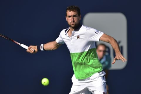 Marin Cilic, of Croatia, prepares to hit a forehand to Andrey Rublev, of Russia, at the Miami Open tennis tournament Saturday, March 23, 2019, in Miami Gardens, Fla. (AP Photo/Jim Rassol)
