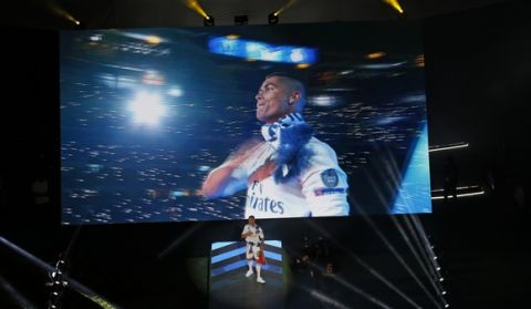Real Madrid's Cristiano Ronaldo gestures to supporters as he celebrates with the rest of the team after winning the Champions League final, at the Santiago Bernabeu stadium in Madrid, Spain, Sunday, June 4, 2017. Real Madrid became the first team in the Champions League era to win back-to-back titles with their 4-1 victory over Juventus in Cardiff, Wales, on Saturday. (AP Photo/Francisco Seco)