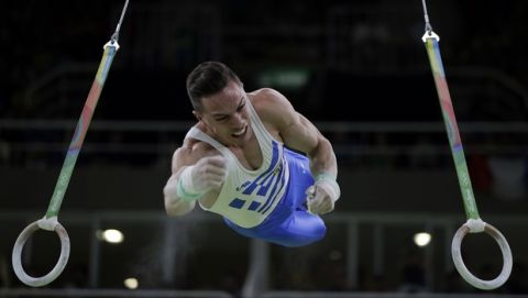 Greece's Eleftherios Petrounias performs on the rings during the artistic gymnastics men's apparatus final at the 2016 Summer Olympics in Rio de Janeiro, Brazil, Monday, Aug. 15, 2016. (AP Photo/Julio Cortez)