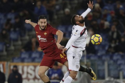 Roma's Kostas Manolas and Cagliari's Joao Pedro, right, vie for the ball during an Italian Serie A soccer match between AS Roma and Cagliari, at the Olympic stadium in Rome, Saturday, Dec. 16, 2017. (AP Photo/Gregorio Borgia)
