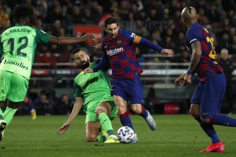 Barcelona's Lionel Messi vies for the ball with Leganes' Dimitris Siovas during a Spanish Copa del Rey soccer match between Barcelona and Leganes at the Camp Nou stadium in Barcelona, Spain, Thursday, Jan. 30, 2020. (AP Photo/Joan Monfort)