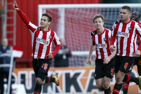 Brentford's Harry Forrester, left, celebrates after scoring against Chelsea during their English FA Cup fourth round soccer match in London, Sunday, Jan. 27, 2013. The match ended in a 2-2 draw. (AP Photo/Lefteris Pitarakis)