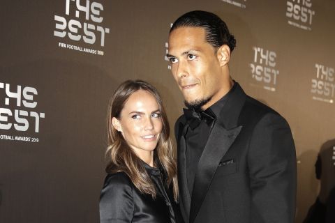 Netherlands defender Virgil van Dijk arrives with his partner Like Nooitgedagt to attend the Best FIFA soccer awards, in Milan's La Scala theater, northern Italy, Monday, Sept. 23, 2019. Virgil van Dijk is up against five-time winners Cristiano Ronaldo and Lionel Messi for the FIFA best player award and United States forward Megan Rapinoe is the favorite for the women's award. (AP Photo/Luca Bruno)