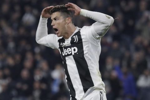 Juventus' Cristiano Ronaldo celebrates after scoring the opening goal during the Champions League round of 16, 2nd leg, soccer match between Juventus and Atletico Madrid at the Allianz stadium in Turin, Italy, Tuesday, March 12, 2019. (AP Photo/Luca Bruno)