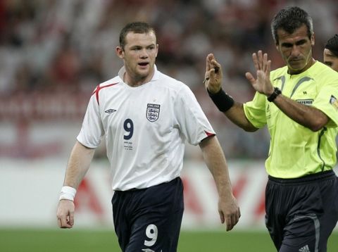 ENGLAND V PORTUGAL. GELSENKIRCHEN. GERMANY. PIC ANDY HOOPER
WAYNE ROONEY AND THE REF
