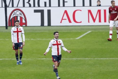 Genoa's Francesco Cassata, center, celebrates after scoring his side's second goal during the Serie A soccer match between AC Milan and Genoa at the San Siro stadium, in Milan, Italy, Sunday, March 8, 2020. (AP Photo/Antonio Calanni)