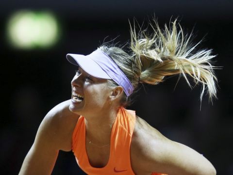 Russia's Maria Sharapova serves against Italy's Roberta Vinci at the Porsche Tennis Grand Prix in Stuttgart, Germany, Wednesday, April 26, 2017. It is Sharapova's first match after a 15 months lasting doping ban. (AP Photo/Michael Probst)