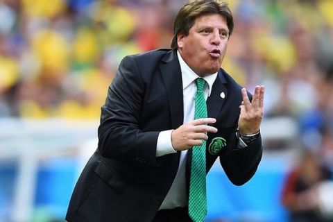 FORTALEZA, BRAZIL - JUNE 17:  Head coach Miguel Herrera of Mexico gestures during the 2014 FIFA World Cup Brazil Group A match between Brazil and Mexico at Castelao on June 17, 2014 in Fortaleza, Brazil.  (Photo by Laurence Griffiths/Getty Images)