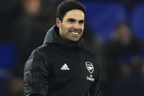 Arsenal's head coach Mikel Arteta smiles after the end of the English Premier League soccer match between Chelsea and Arsenal at Stamford Bridge stadium in London England, Tuesday, Jan. 21, 2020. (AP Photo/Leila Coker)