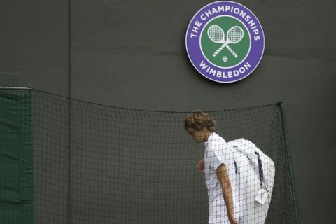 Germany's Alexander Zverev leaves the court after losing to Czech Republic's in a Men's singles match during day one of the Wimbledon Tennis Championships in London, Monday, July 1, 2019. (AP Photo/Tim Ireland)