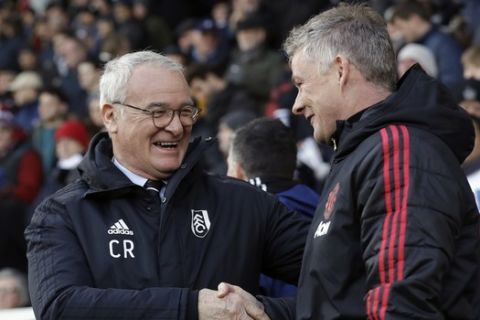 Fulham manager Claudio Ranieri, left, shakes hands with Manchester United caretaker head coach Ole Gunnar Solskjaer prior the English Premier League soccer match between Fulham and Manchester United at Craven Cottage stadium in London, Saturday, Feb. 9, 2019. (AP Photo/Matt Dunham)