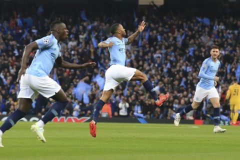 Manchester City midfielder Raheem Sterling, center, celebrates his side's first goal during the Champions League quarterfinal, second leg, soccer match between Manchester City and Tottenham Hotspur at the Etihad Stadium in Manchester, England, Wednesday, April 17, 2019. (AP Photo/Jon Super)