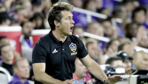 LA Galaxy head coach Guillermo Barros Schelotto directs his team against Orlando City during the second half of an MLS soccer match, Friday, May 24, 2019, in Orlando, Fla. (AP Photo/John Raoux)