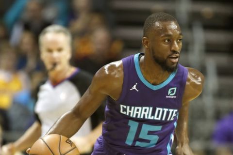 Charlotte Hornets' Kemba Walker (15) dribbles ther ball up-court against the Cleveland Cavaliers during the first half of an NBA basketball game in Charlotte, N.C., Saturday, Nov. 3, 2018. The Hornets won 126-94. (AP Photo/Bob Leverone)