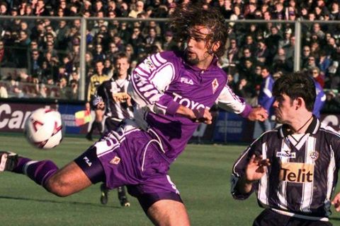 Fiorentina's Gabriel Batistuta of Argentina, left, and Udinese's Andrea Sottil in action during Italian Serie A top league soccer match Fiorentina vs Udinese, in Florence, Sunday, February 13, 2000. (AP Photo/Fabrizio Giovannozzi)