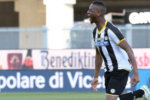 Udinese's Molla Wague, celebrates after scoring, during the Serie A soccer match between Udinese and Torino at the Friuli Stadium in Udine, Italy, Sunday, March 8, 2015. (AP Photo/Paolo Giovannini)