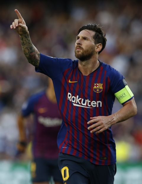 Barcelona forward Lionel Messi celebrates after scoring the opening goal of his team during the group B Champions League soccer match between FC Barcelona and PSV Eindhoven at the Camp Nou stadium in Barcelona, Spain, Tuesday, Sept. 18, 2018. (AP Photo/Manu Fernandez)