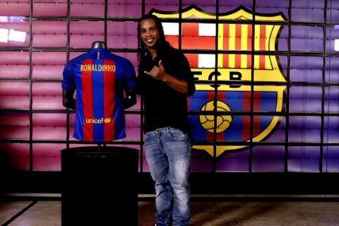 FC Barcelona former player Ronaldinho gestures during his official presentation as new FC Barcelona ambassador at the Camp Nou stadium in Barcelona, Spain, Friday, Feb. 3, 2017. Ronaldinho will be named its new ambassador, representing the club at various institutional events and helping "globalize the Barca brand and its values. (AP Photo/Manu Fernandez)