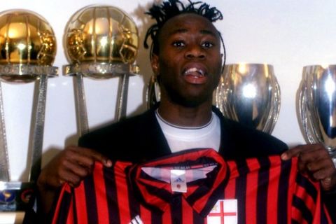 Nigerian defender Taribo West poses with the A.C. Milan jersey during the official presentation in Milan, Monday Dec. 20, 1999 (AP Photo/Luca Bruno)