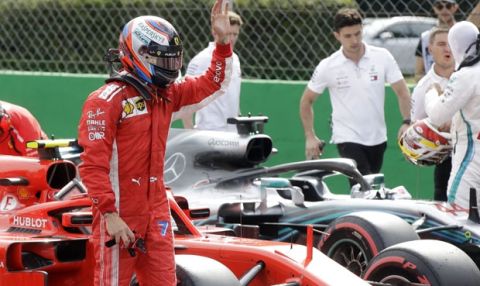 Ferrari driver Kimi Raikkonen of Finland celebrates after setting a pole position in the qualifying session at the Monza racetrack, in Monza, Italy, Saturday, Sept. 1, 2018. The Formula One race will be held on Sunday. (AP Photo/Luca Bruno)