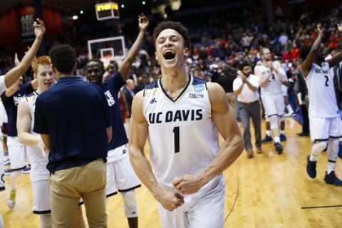 UC Davis' Lawrence White (1) celebrates after a First Four game of the NCAA men's college basketball tournament, Wednesday, March 15, 2017, in Dayton, Ohio. UC Davis defeated North Carolina Central 67-63. (AP Photo/John Minchillo)