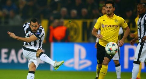 DORTMUND, GERMANY - MARCH 18: Carlos Tevez of Juventus scores the opening goal during the UEFA Champions League Round of 16 between Borussia Dortmund and Juventus at Signal Iduna Park on March 18, 2015 in Dortmund, Germany.  (Photo by Alex Grimm/Bongarts/Getty Images)