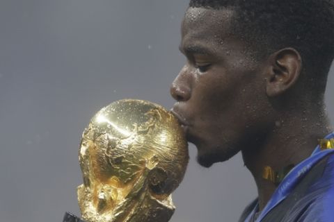 France's Paul Pogba kisses the trophy after the final match between France and Croatia at the 2018 soccer World Cup in the Luzhniki Stadium in Moscow, Russia, Sunday, July 15, 2018. (AP Photo/Natacha Pisarenko)