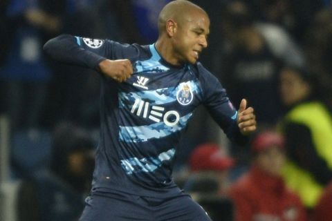 Porto's Algerian midfielder Yacine Brahimi celebrates after scoring a goal during the UEFA Champions League round of 16 second leg football match FC Porto vs FC Basel at the Dragao stadium in Porto on March 10, 2015.   AFP PHOTO/ MIGUEL RIOPA        (Photo credit should read MIGUEL RIOPA/AFP/Getty Images)
