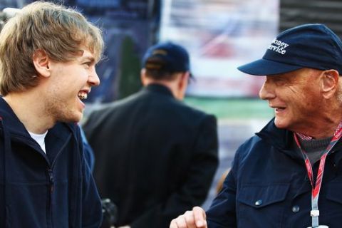 MELBOURNE, AUSTRALIA - MARCH 27:  Current F1 World Champion Sebastian Vettel (L) of Germany and Red Bull Racing shares a joke with former F1 World Champion Niki Lauda (R) in the paddock before the Australian Formula One Grand Prix at the Albert Park Circuit on March 27, 2011 in Melbourne, Australia.  (Photo by Robert Cianflone/Getty Images) *** Local Caption *** Sebastian Vettel; Niki Lauda