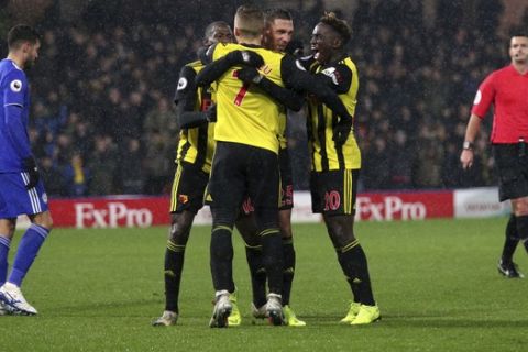Watford's Jose Holebas celebrates scoring his side's second goal of the game with his team-mates during the English Premier League soccer match between Watford F.C and Cardiff City at Vicarage Road stadium, London, England. Saturday Dec. 15, 2018. (Yoi Mok/PA via AP)