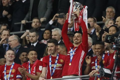 United's Zlatan Ibrahimovic lifted the trophy after they won the English League Cup final soccer match between Manchester United and Southampton FC at Wembley stadium in London, Sunday, Feb. 26, 2017. (AP Photo/Kirsty Wigglesworth)