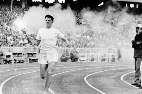 Australian athlete Ron Clarke carries the Olympic torch into the Melbourne Cricket Ground during the opening ceremony of the 1956 Melbourne Olympic Games on 22 November 1956  (Photo by Staff/The Sydney Morning Herald/Fairfax Media via Getty Images)