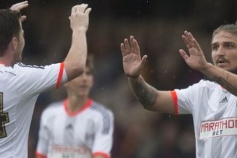 Fulham's Ross McCormack (left) celebrates Konstantinos Stafylidis' (right) goal