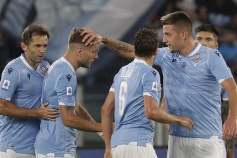 Lazio's Ciro Immobile, second from left, celebrates with his teammates after e scored their side's first goal during a Serie A soccer match between Lazio and Pama, at Rome's Olympic Stadium, Sunday, Sept. 22, 2019. (AP Photo/Andrew Medichini)