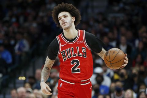 Chicago Bulls guard Lonzo Ball (2) dribbles up court against the Dallas Mavericks in the first half of an NBA basketball game in Dallas, Sunday, Jan. 9, 2022. (AP Photo/Tim Heitman)