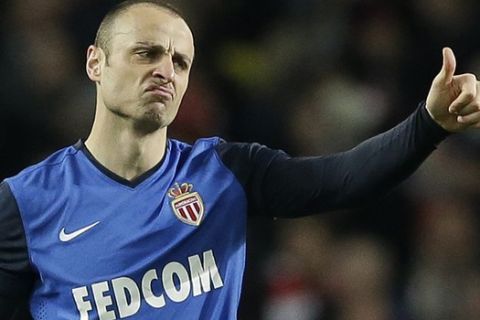 Monaco's Dimitar Berbatov gestures after scoring his side's second goal during the Champions League round of 16 soccer match between Arsenal and AS Monaco at the Emirates Stadium in London, Wednesday, Feb. 25, 2015.  (AP Photo/Matt Dunham)

